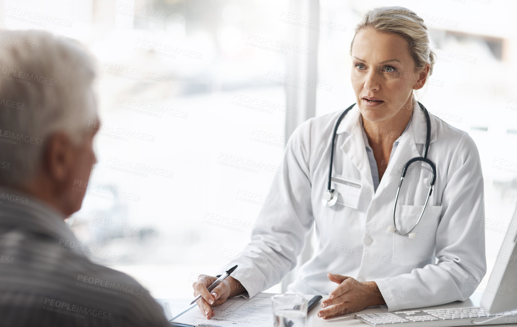 Buy stock photo Doctor, woman and senior patient in healthcare consultation for assessment, history and exam with checkup or diagnosis. Medical worker talking of insurance checklist, document or helping with advice