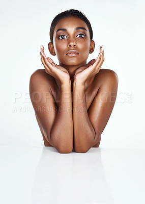 Buy stock photo Studio shot of a beautiful young woman posing against a light background