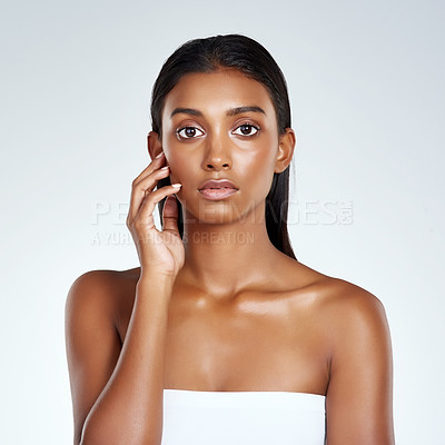 Buy stock photo Beauty, studio and portrait of Indian woman with skincare from dermatology in mockup space. Face, makeup and girl with confidence from healthy facial or pride from cosmetics in white background