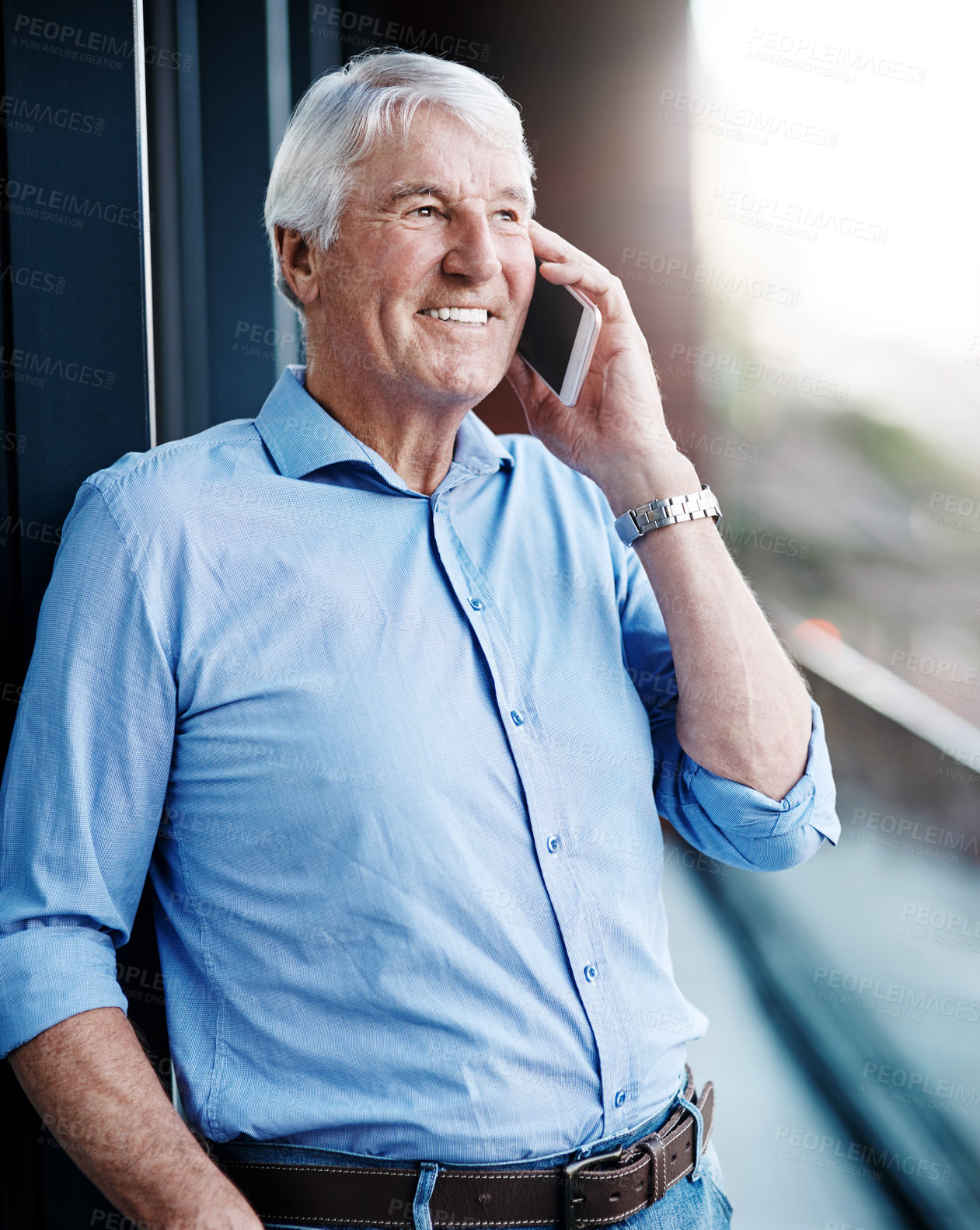 Buy stock photo Cropped shot of a senior businessman on a call outside the office