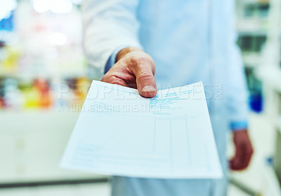 Buy stock photo Cropped shot of an unrecognizable male pharmacist working in a pharmacy
