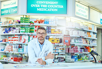 Buy stock photo Cropped portrait of a handsome mature male pharmacist working in a pharmacy