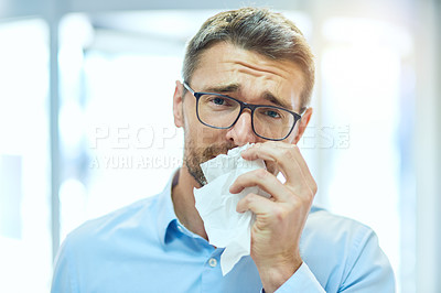 Buy stock photo Cropped portrait of a handsome mature businessman blowing his nose