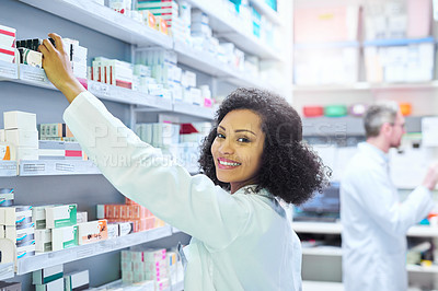 Buy stock photo Woman, pharmacy and portrait by shelf for inventory, stock and drugs for order from supplier. Pharmacist, people and happy with pride for career with product, pills and health with box at store