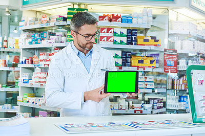 Buy stock photo Man, pharmacist and tablet with green screen with healthcare, store and mockup with pharmaceutical promo on app. Mature pharma expert, digital touchscreen and space with chromakey for mock up in shop
