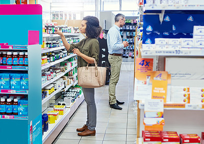 Buy stock photo Cropped shot of a female customer in a pharmacy