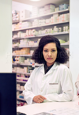 Buy stock photo Cropped portrait of an attractive young female pharmacist working in a pharmacy