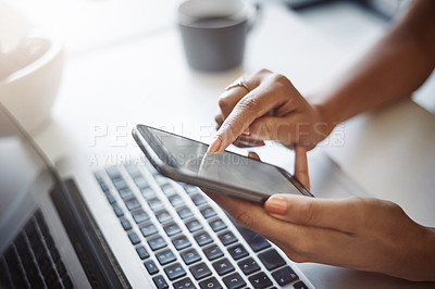 Buy stock photo Woman, hands and phone at a laptop for work networking and employee typing. Female worker, table and social network app with mobile communication and text for professional and web connection