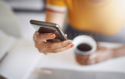 Buy stock photo Closeup shot of an unrecognizable female designer using a cellphone in her home office
