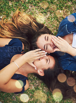 Buy stock photo High angle shot of two female best friends spending the day in a public park