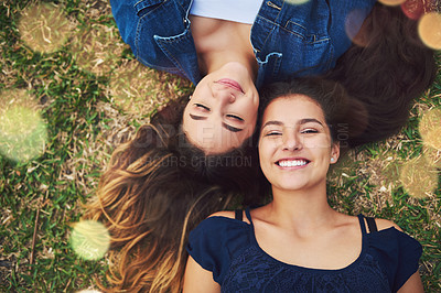 Buy stock photo Teen, friends and park portrait with student, love and care together on summer holiday and school break. Garden, lawn and lying on grass with young, happy and women smile outdoor on vacation above