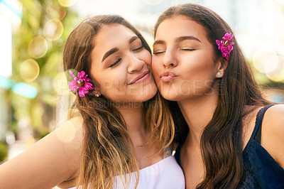 Buy stock photo Cropped shot of two female best friends spending the day in the city