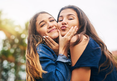 Buy stock photo Cropped shot of two female best friends being playful in a public park