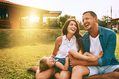 Buy stock photo Cropped shot of a young family spending time together outdoors