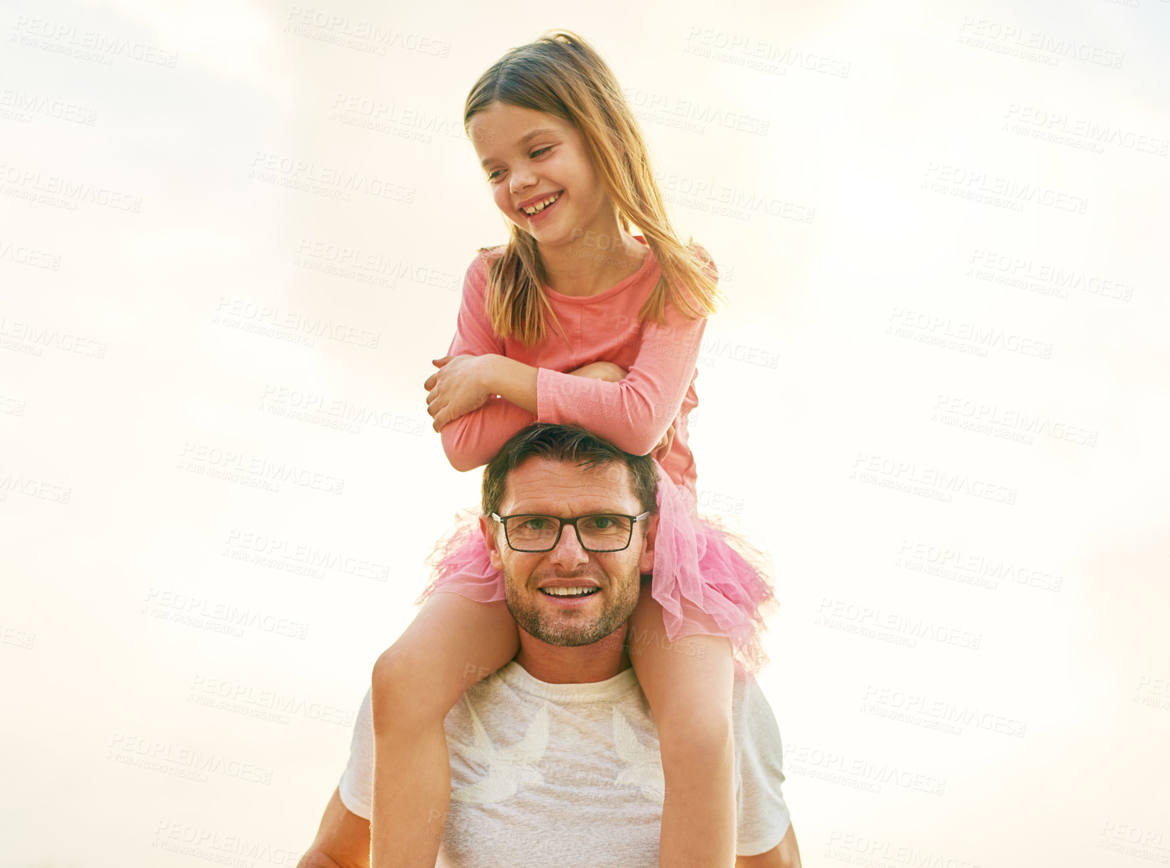 Buy stock photo Cropped portrait of a mature man carrying his daughter on his shoulders outside
