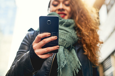 Buy stock photo City, typing and woman in street with phone, smile and checking travel website for schedule. Scroll, search and girl with smartphone, online chat or social media post for urban adventure in low angle