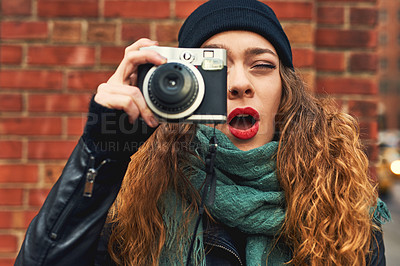 Buy stock photo Cropped shot of a young woman out in the city with her camera