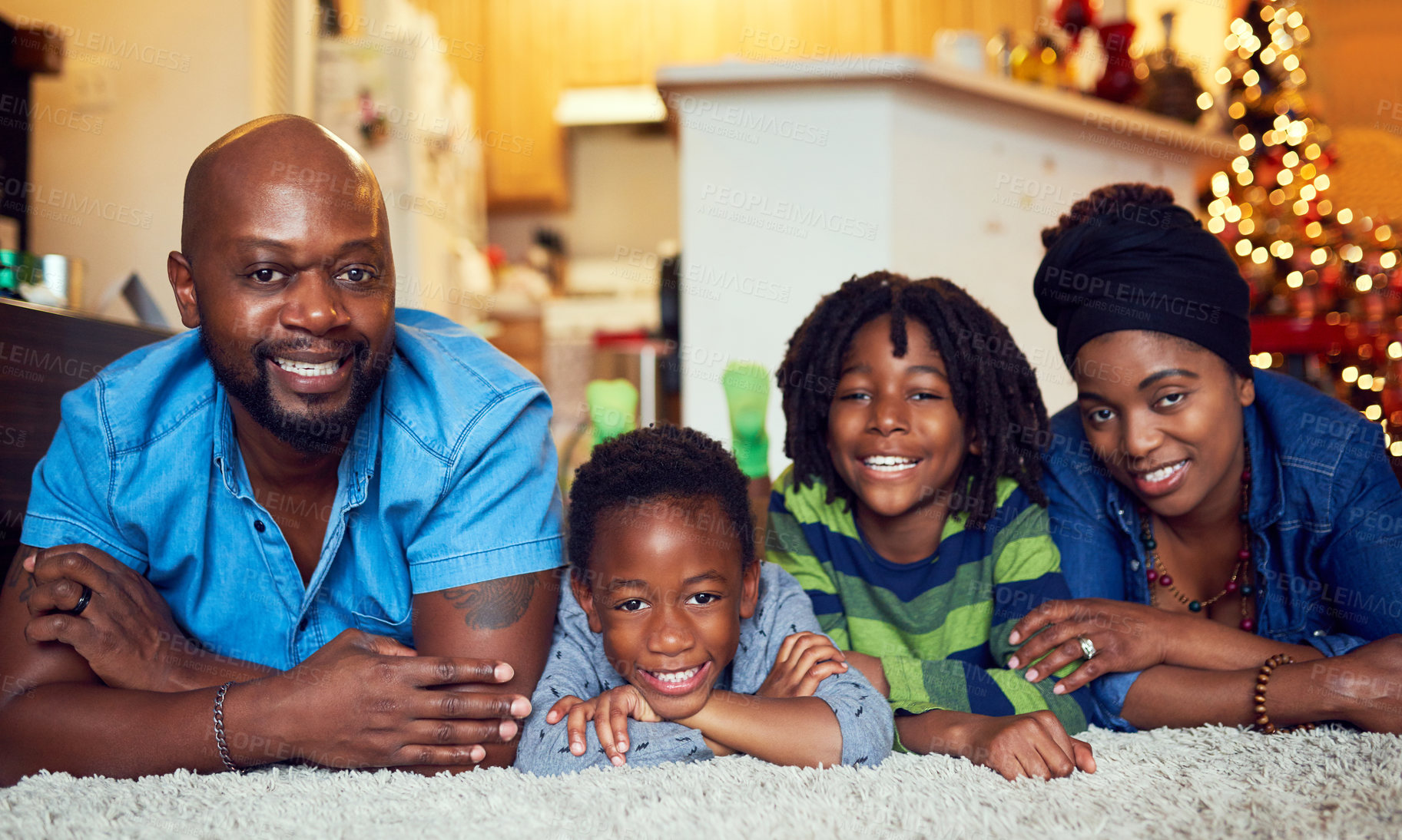 Buy stock photo Shot of a family of four spending the day at home