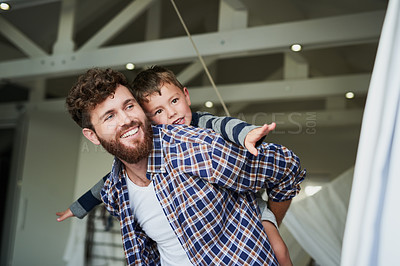 Buy stock photo Cropped shot of an adorable little boy on his dad's back with his arm's stretched out
