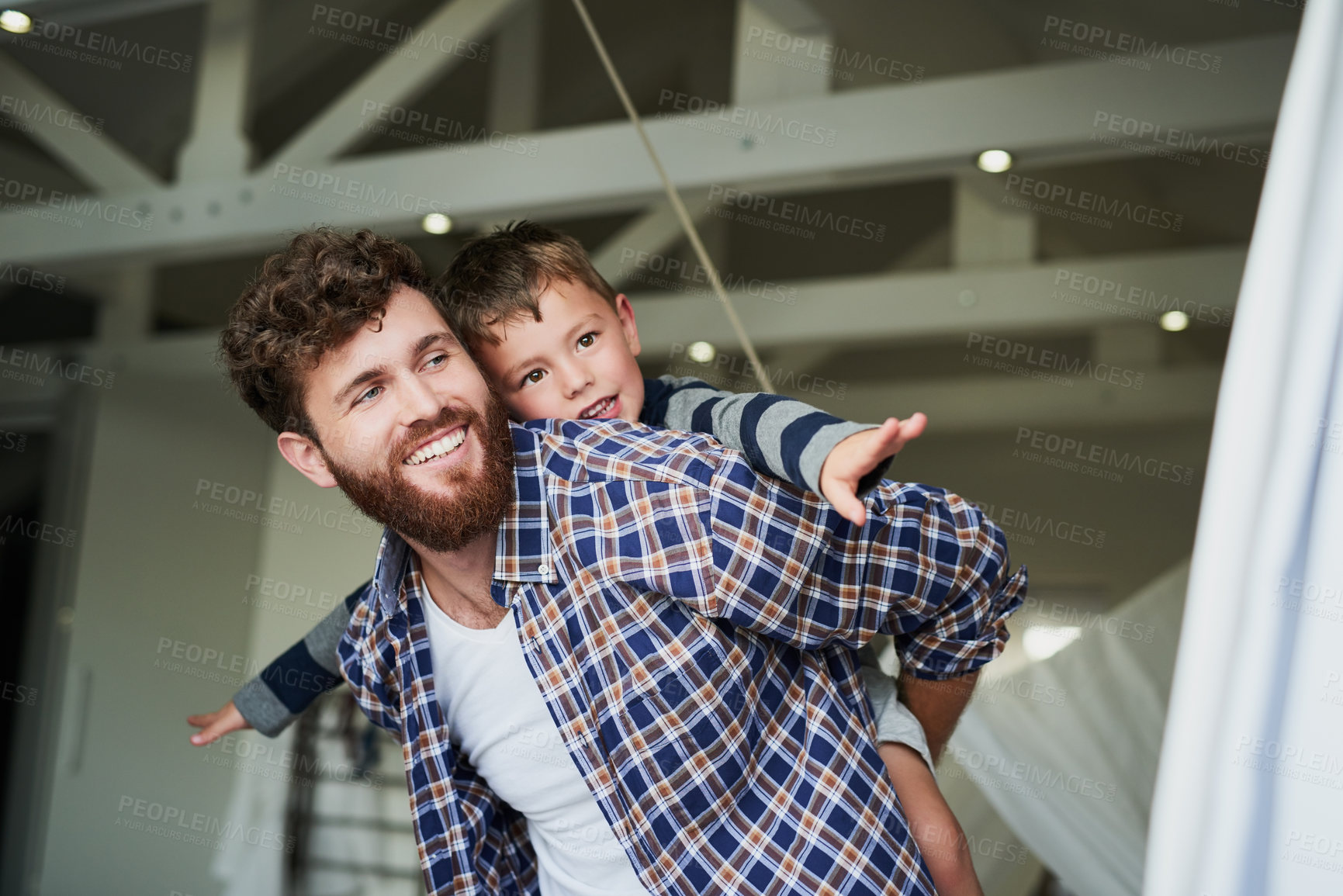 Buy stock photo Cropped shot of an adorable little boy on his dad's back with his arm's stretched out