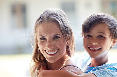 Buy stock photo Cropped shot of a mother and son spending time together at home