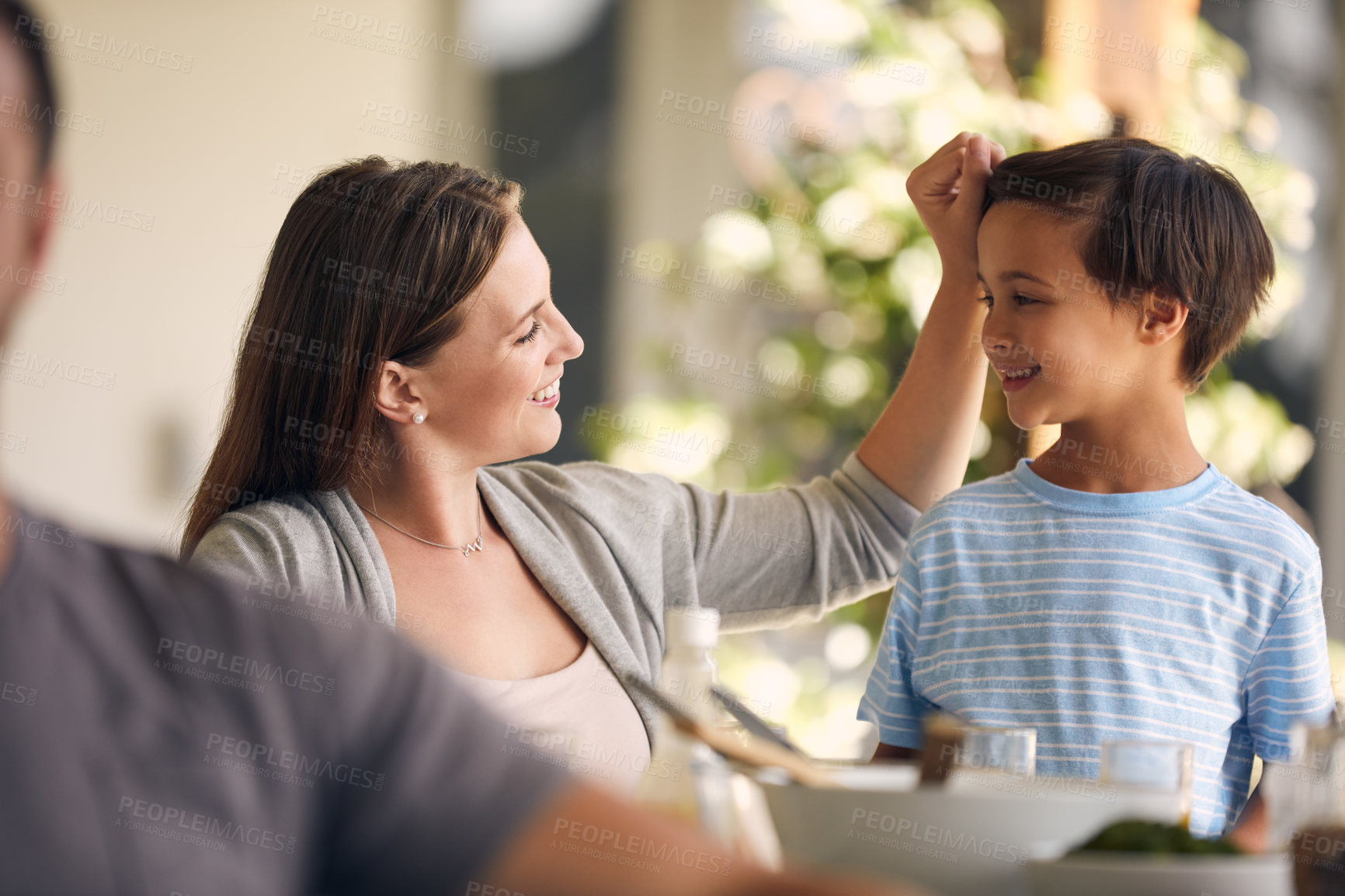 Buy stock photo Happy, talking and mom with boy in backyard at home for bonding, loving relationship and meal together. Outdoor, family and mother with child on patio for connection, love and affection on weekend