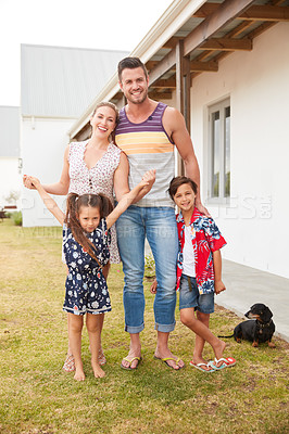 Buy stock photo Shot of a family of four spending quality time together at home