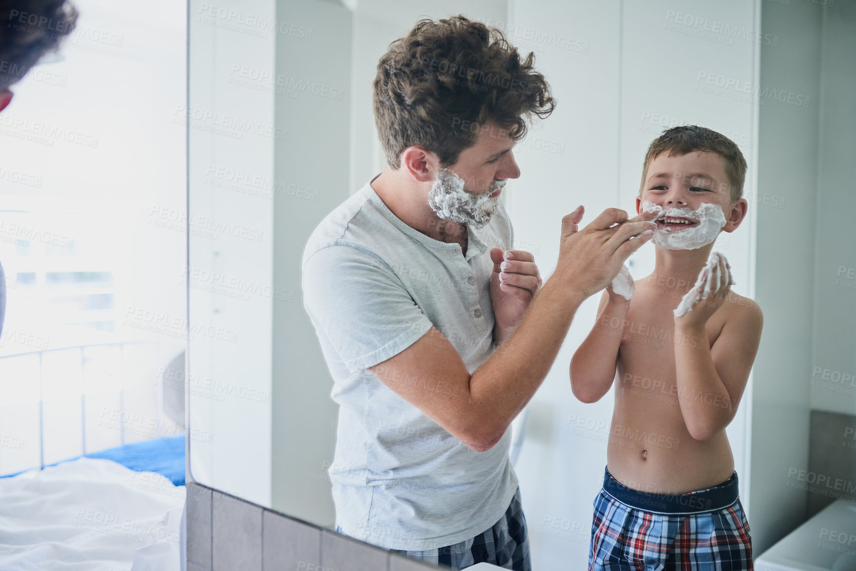 Buy stock photo Father, child and learning to shave in bathroom, having fun or bonding together. Smile, dad and teach kid with shaving cream on face, playing or cleaning, hygiene or enjoying hair removal with care.