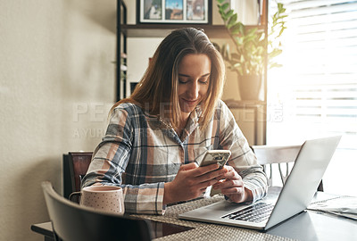 Buy stock photo Cropped shot of a young woman using a laptop in the morning at home