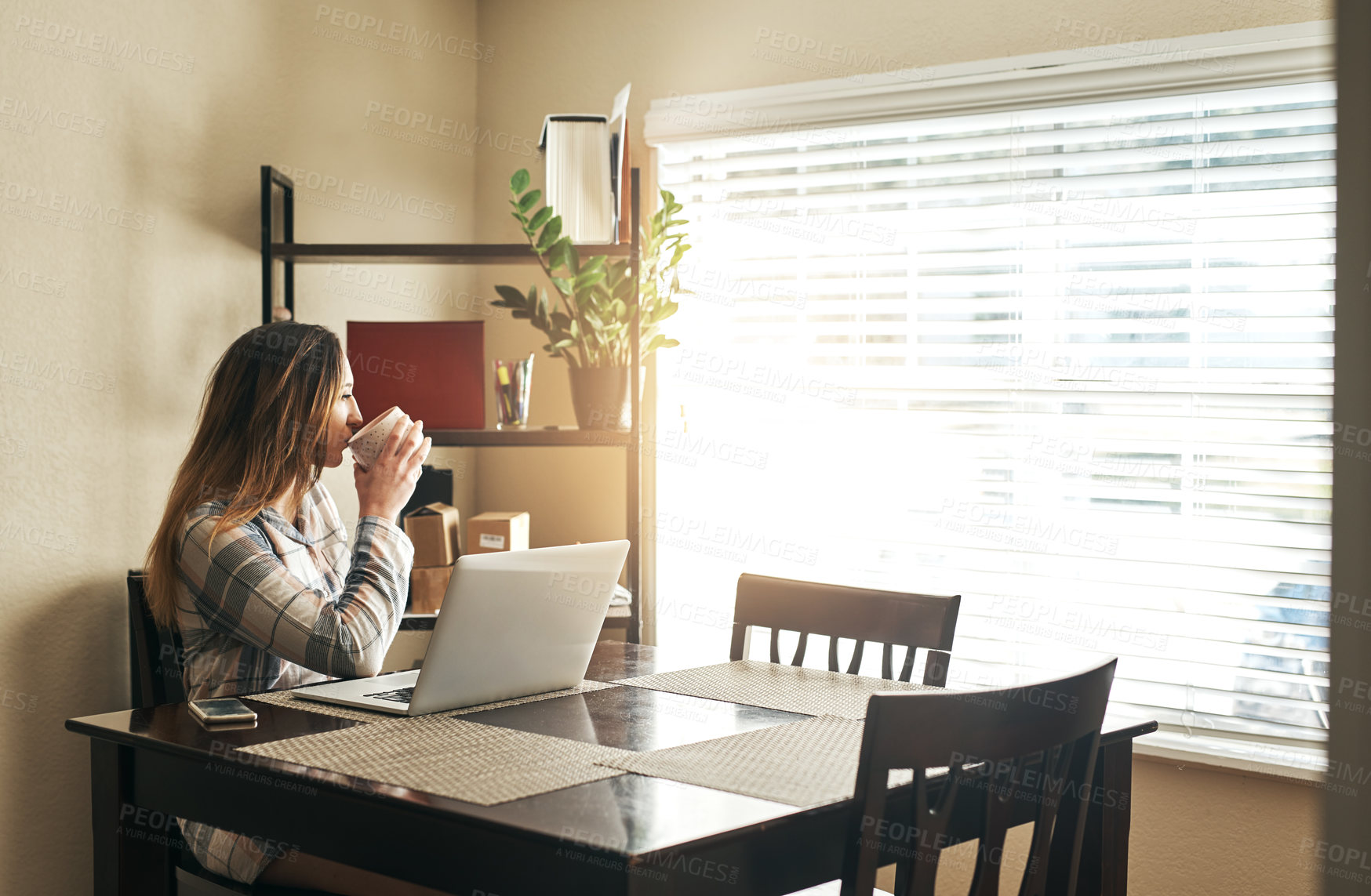 Buy stock photo Woman, drinking coffee and window in home office with thinking as creative copywriter in web agency. Female person, planning and technology for working, communication and connection as digital nomad