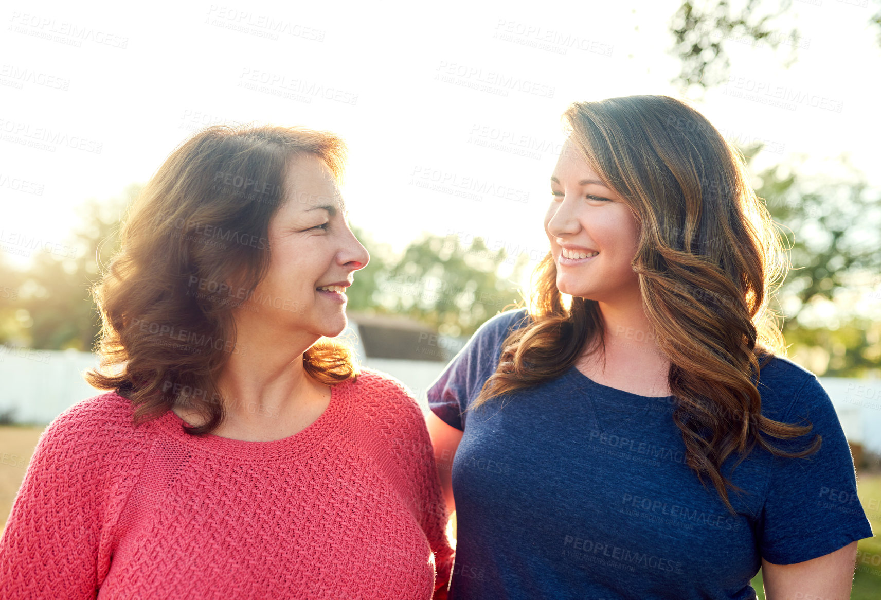 Buy stock photo Portrait of a mother and her adult daughter in the backyard at home