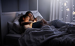 Snuggling up with a good story on their device