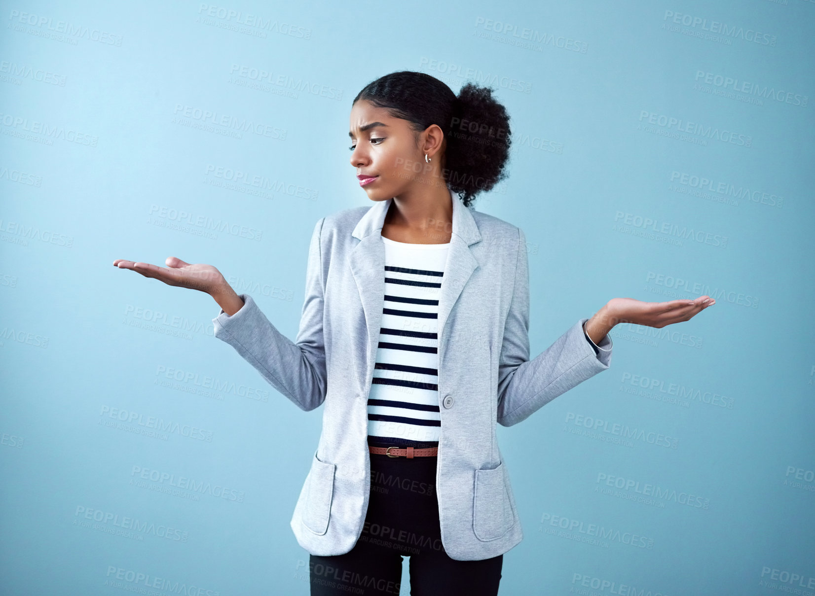 Buy stock photo Professional black corporate business woman making a hand gesture for decision, choice and balance while standing against a blue studio background alone. One African manager choosing between ideas