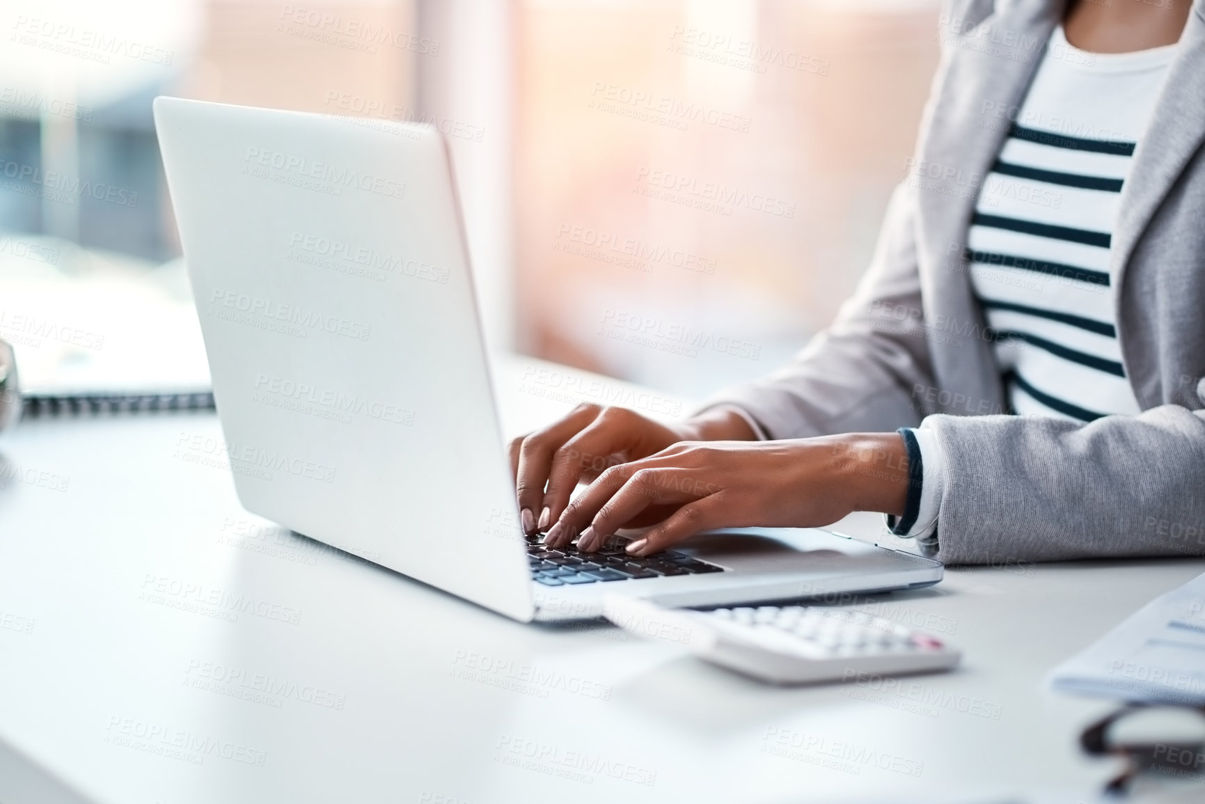 Buy stock photo Hands, businesswoman typing on laptop and in office sitting at her desk at work. Social networking or technology, business and female person type an email or write a financial report at her workplace