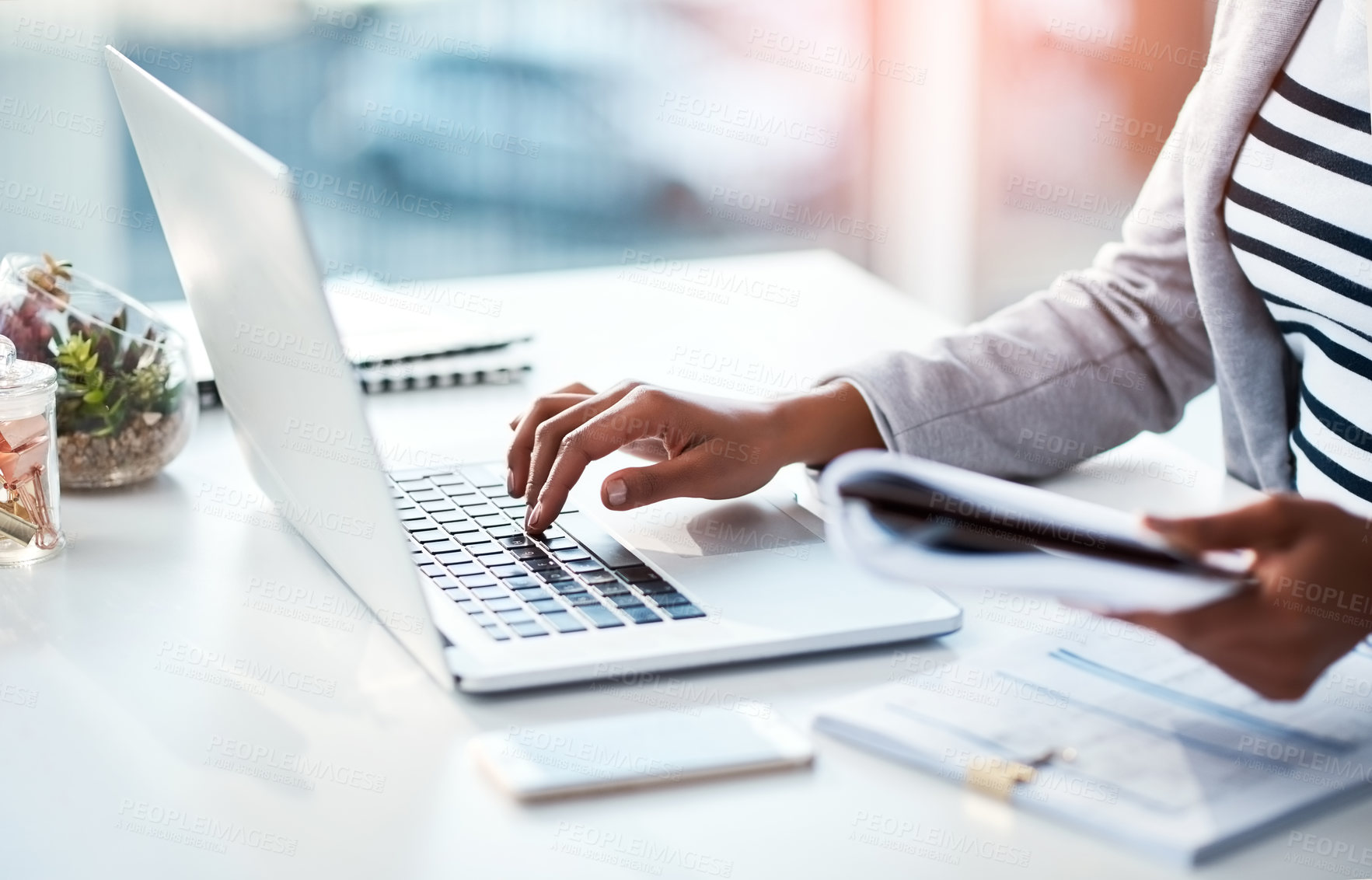 Buy stock photo Hands of a female entrepreneur sending emails and doing research on the internet. Businesswoman, secretary and data professional typing on a laptop while analyzing financial reports in her office. 