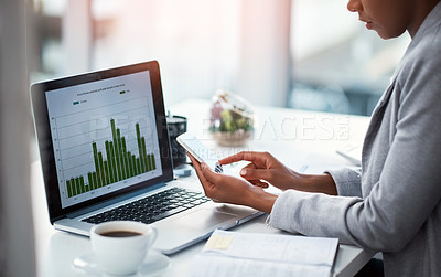 Buy stock photo An accountant working on growth, tax review or expenses of a company with graphs or charts on a laptop screen. Closeup of a financial advisor typing on a phone while analyzing business statistics