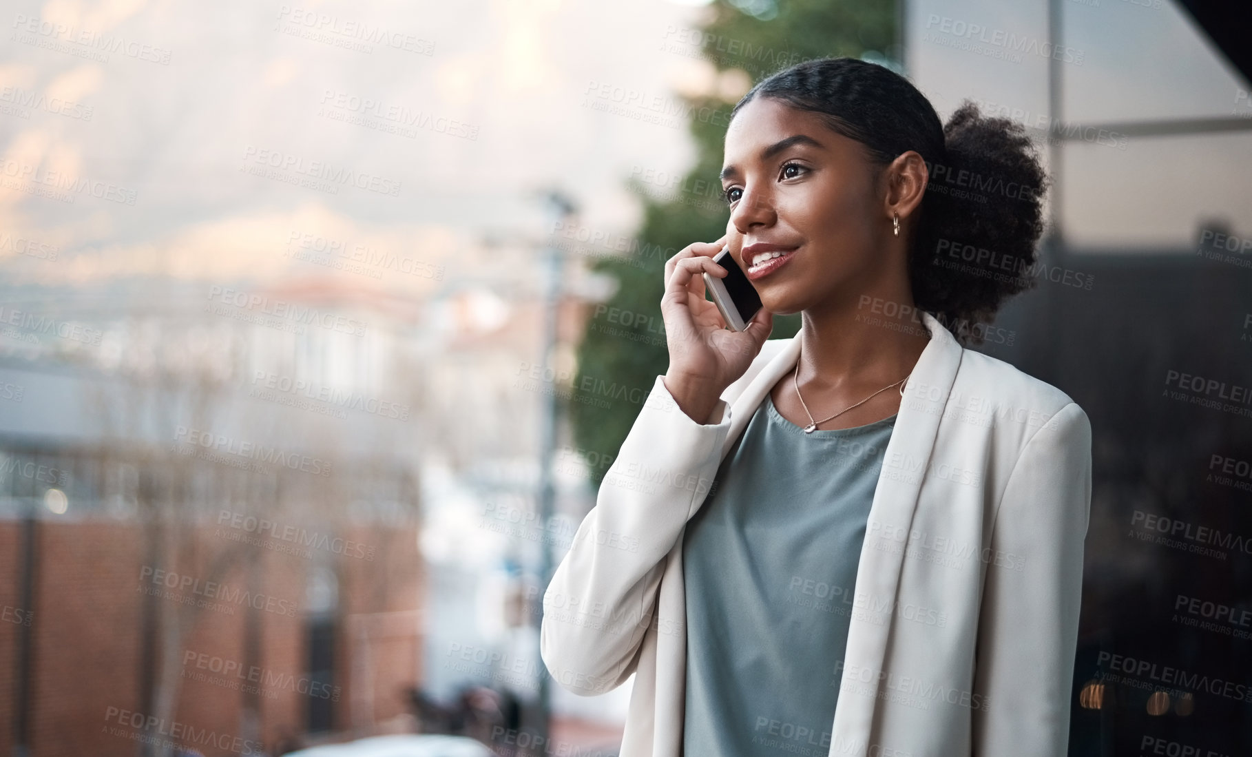 Buy stock photo Talking on a phone, communication and networking with a young, confident and ambitious young business woman on a balcony. Professional and creative designer on a call for work discussion and planning