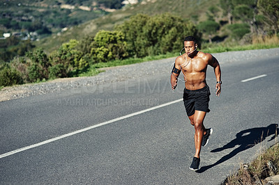 Buy stock photo Shot of a young handsome man running outdoors