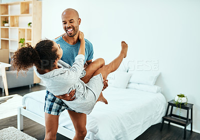 Buy stock photo Shot of an affectionate young couple in their bedroom