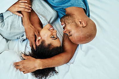 Buy stock photo Cuddle, happy and above of couple in bed in morning for bonding, relationship and love. Marriage, home and man and woman in bedroom embrace for comfort, resting and affection for trust and care