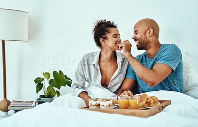 Buy stock photo Breakfast in bed, eating and couple in morning for love, romantic gesture and anniversary celebration. Marriage, valentines day and man and woman with food on tray for bonding, relationship and relax