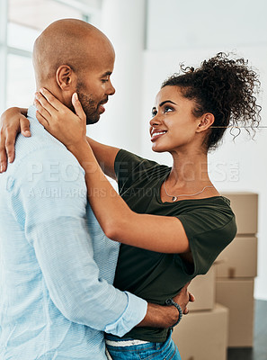 Buy stock photo Black couple hug, moving house and boxes, package or excited in new home for love, care or bonding. Happy black woman, man or embrace for future in apartment, home or property with box, dream or goal