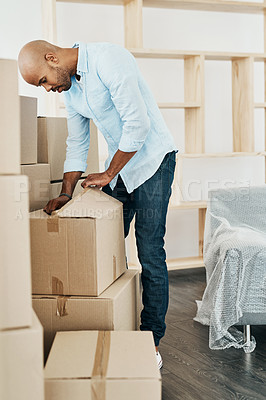 Buy stock photo Man, unpacking and open cardboard for moving with new start, property investment and relocation to dream home. Person, real estate and boxes for residence, checking and rental apartment furniture