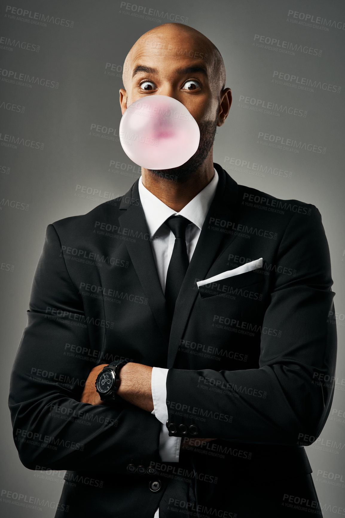 Buy stock photo Studio portrait of a handsome young businessman against a gray background