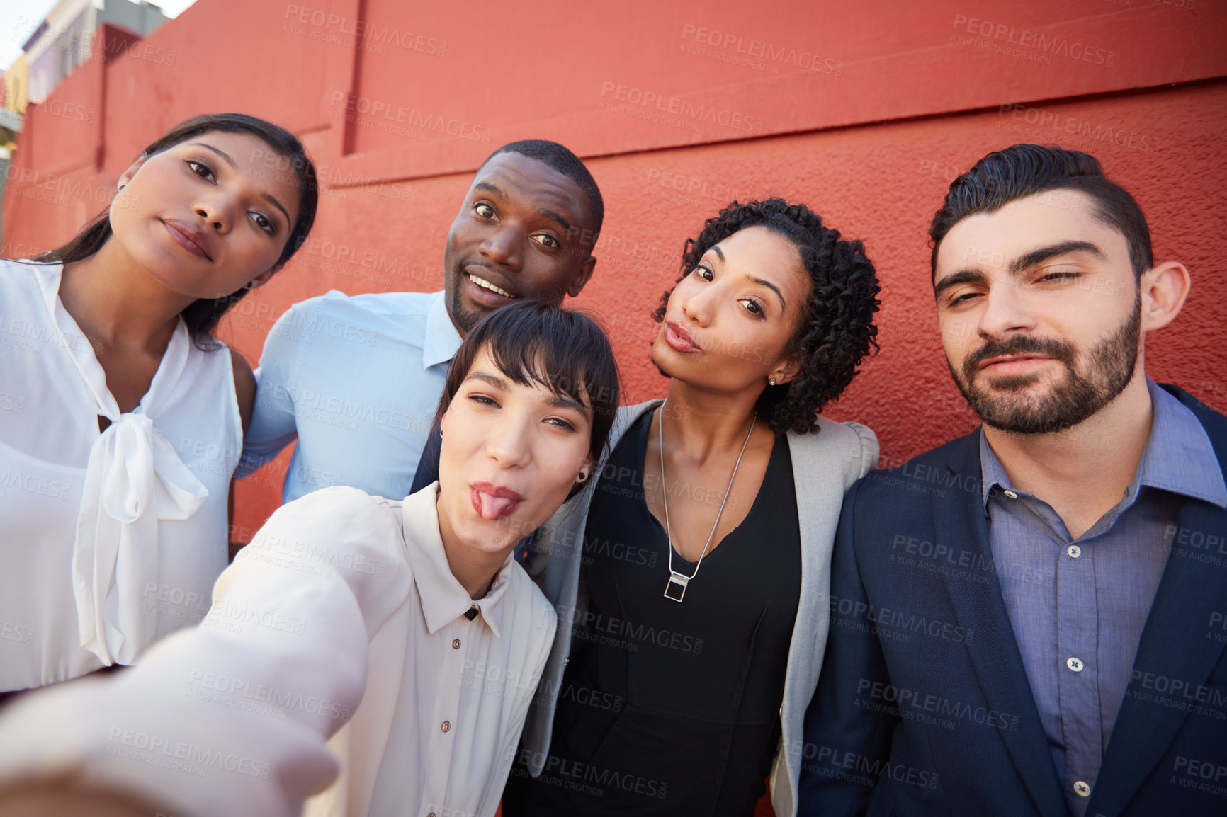Buy stock photo Portrait of a group of businesspeople taking a selfie together outdoors