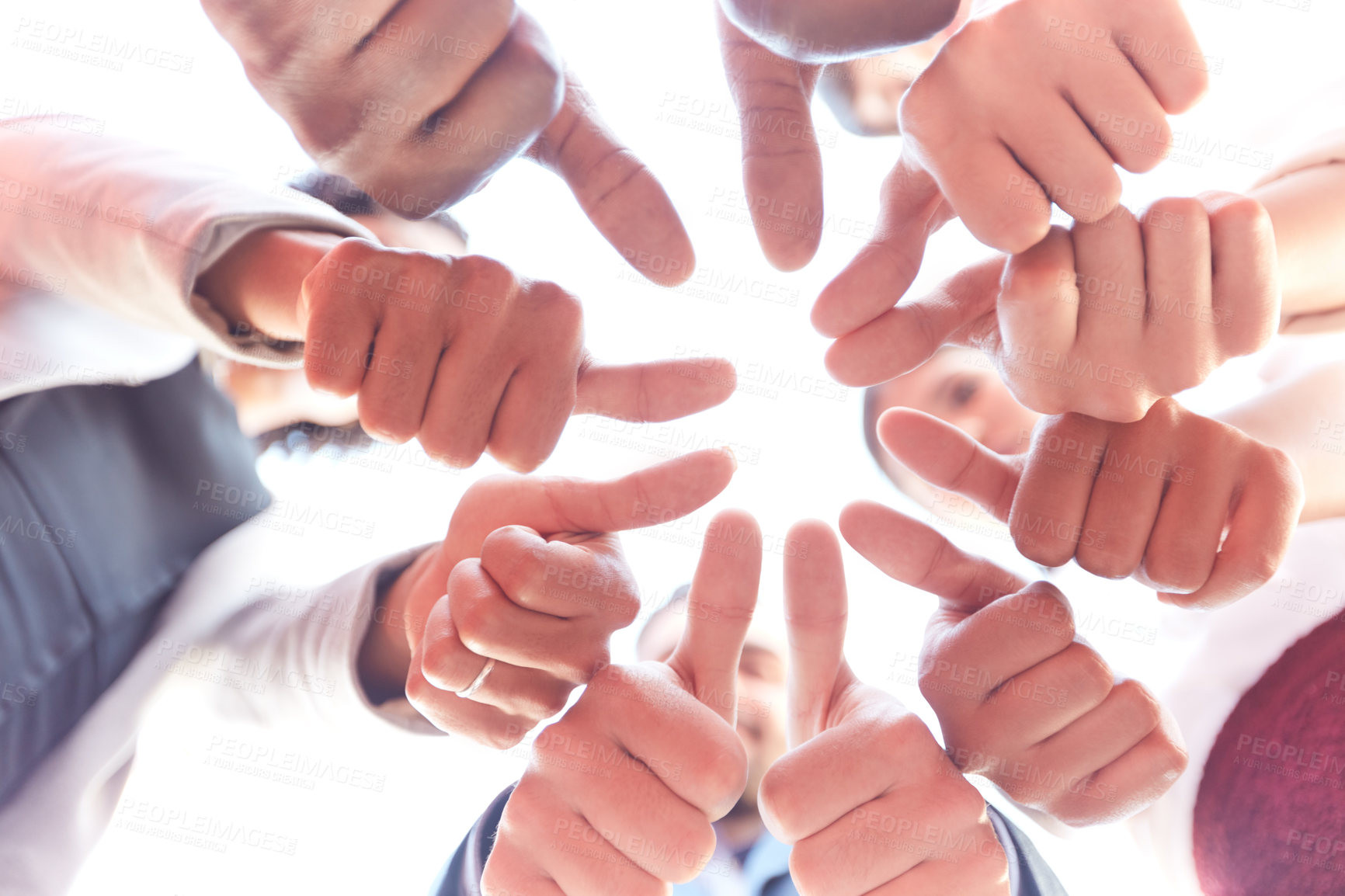 Buy stock photo Closeup shot of a group of unrecognizable businesspeople showing thumbs up outdoors