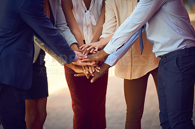 Buy stock photo Closeup shot of an unrecognizable group of businesspeople joining their hands together in unity