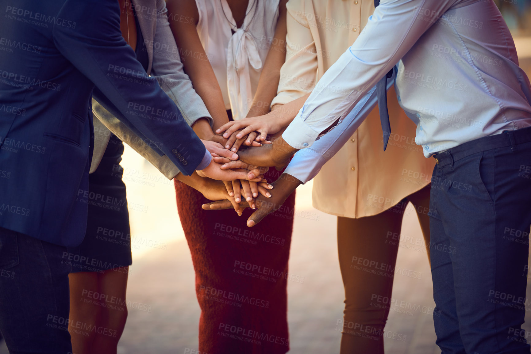 Buy stock photo Closeup shot of an unrecognizable group of businesspeople joining their hands together in unity