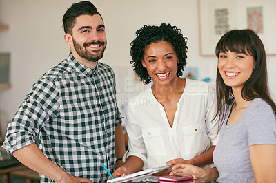 Buy stock photo Portrait of a group of confident young businesspeople working together in a modern office