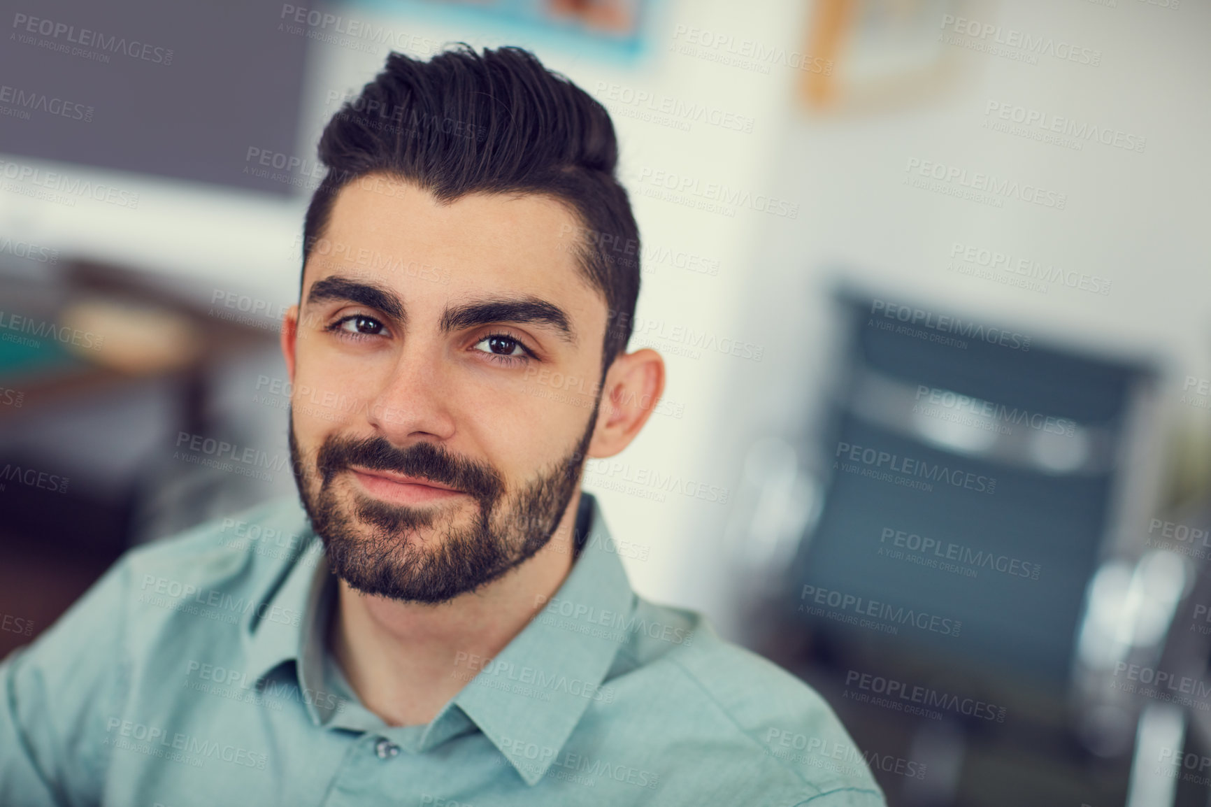 Buy stock photo Portrait of a young businessman working at the office